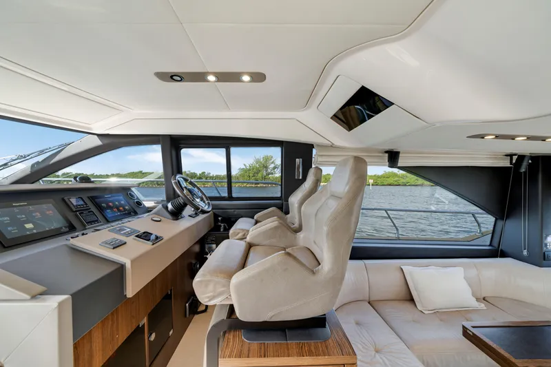 Slide: The Image of Luxurious interior of 2018 Azimut 50 Fly yacht with modern helm and plush seating. - 21