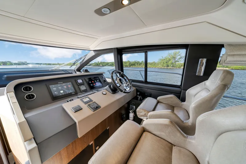 Slide: The Image of Interior of 2018 Azimut 50 Fly yacht cockpit with modern controls and luxurious seating. - 22