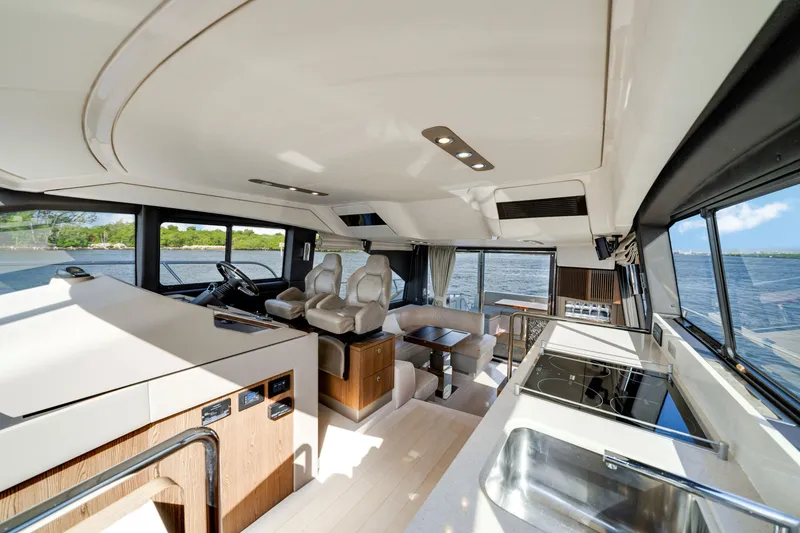 Slide: The Image of Luxurious interior of 2018 Azimut 50 Fly yacht with modern kitchen and seating area. - 24