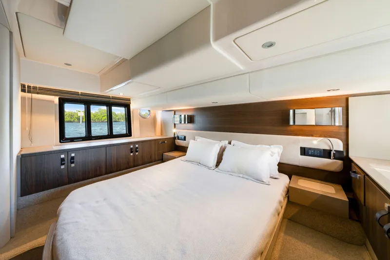 Slide: The Image of Luxurious bedroom interior of 2018 Azimut 50 Fly yacht with modern design and scenic window view. - 26