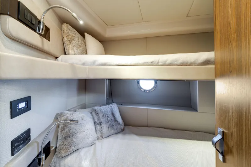 Slide: The Image of Luxurious 2018 Azimut 50 Fly yacht cabin with cozy bunk beds and modern lighting. - 34