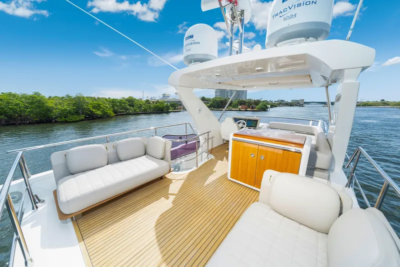 Slide: The Image of Luxurious 2018 Azimut 50 Fly yacht deck with seating, cruising on a scenic waterway. - 35