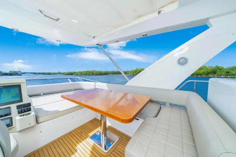 Slide: The Image of Luxurious 2018 Azimut 50 Fly yacht interior with elegant seating and scenic water view. - 37