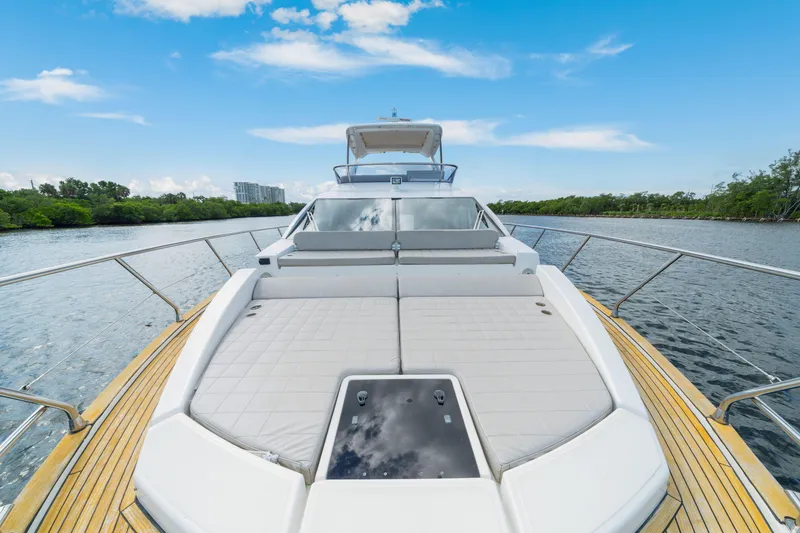 Slide: The Image of 2018 Azimut 50 Fly yacht with spacious deck, cruising on a serene waterway. - 43