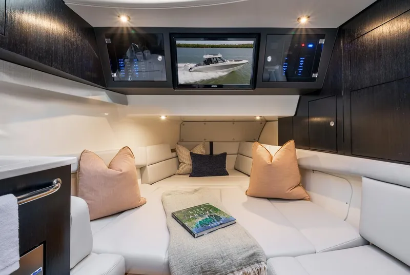 Slide: The Image of Manufacturer Provided Image: Luxurious interior of 2026 Boston Whaler 380 Realm with plush seating and modern amenities. - 13