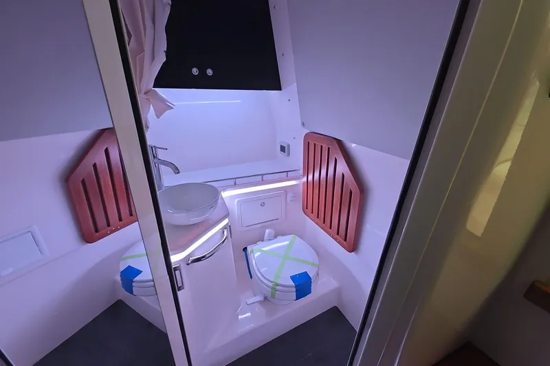 Slide: The Image of Interior of 2026 Boston Whaler 380 Realm boat bathroom with modern fixtures. - 16