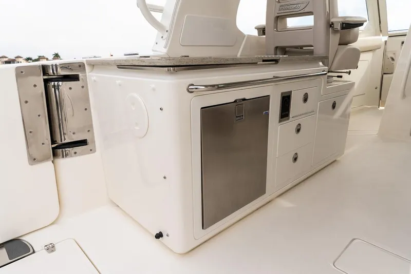 Slide: The Image of Manufacturer Provided Image: Interior view of 2026 Boston Whaler 380 Realm, featuring sleek cabinetry and modern design. - 8