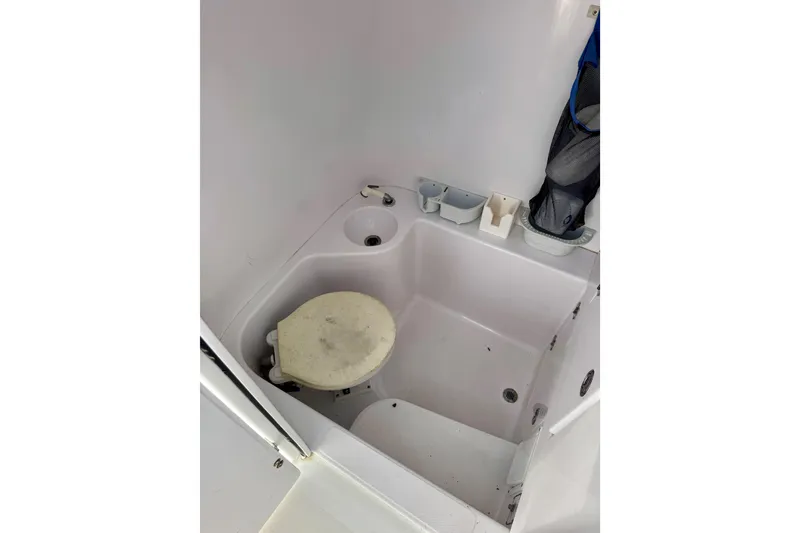 Slide: The Image of 2010 Venture 34 Tournament boat bathroom interior with sink and toilet. - 8