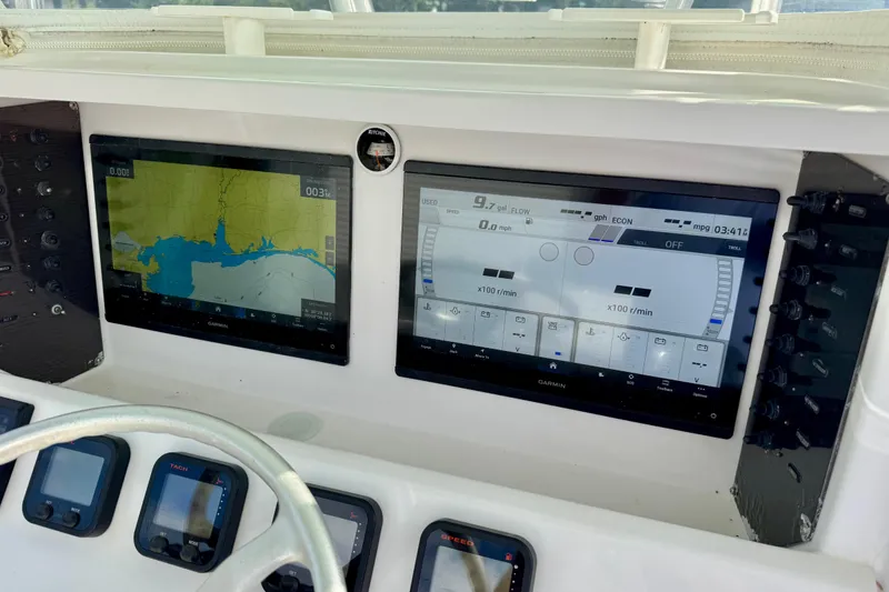 Slide: The Image of Boat dashboard with dual Garmin displays on a 2010 Venture 34 Tournament. - 9