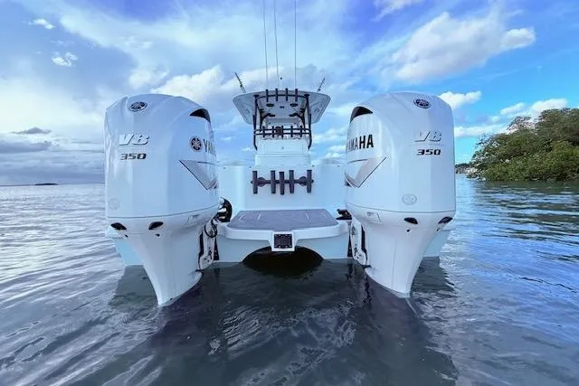 Slide: The Image of 2019 Freeman 34 boat with twin Yamaha V8 350 engines on water. - 20