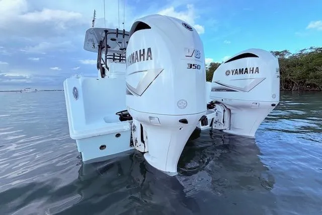 Slide: The Image of 2019 Freeman 34 boat with twin Yamaha V8 350 outboard engines on water. - 21