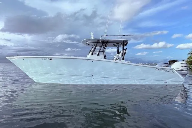 Slide: The Image of 2019 Freeman 34 boat on calm water under cloudy sky. - 29