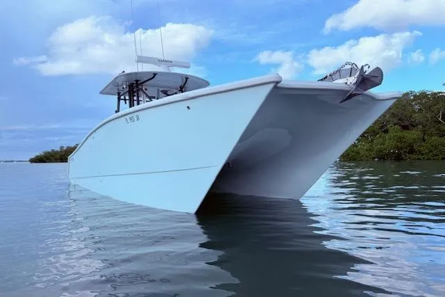 Slide: The Image of 2019 Freeman 34 boat on calm water under a blue sky. - 3