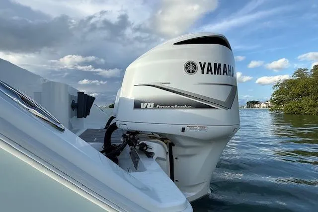 Slide: The Image of Yamaha V8 outboard motor on a 2019 Freeman 34 boat, set against a scenic water backdrop. - 31
