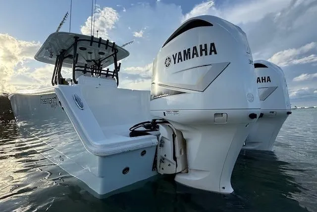 Slide: The Image of 2019 Freeman 34 boat with dual Yamaha engines on calm water. - 32