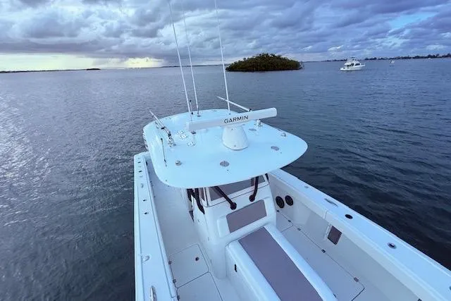 Slide: The Image of 2019 Freeman 34 boat on calm water under cloudy sky. - 37