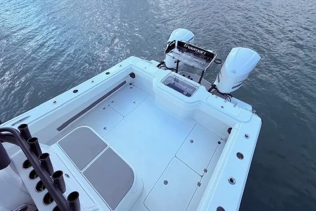 Slide: The Image of 2019 Freeman 34 boat with dual engines on calm water. - 41