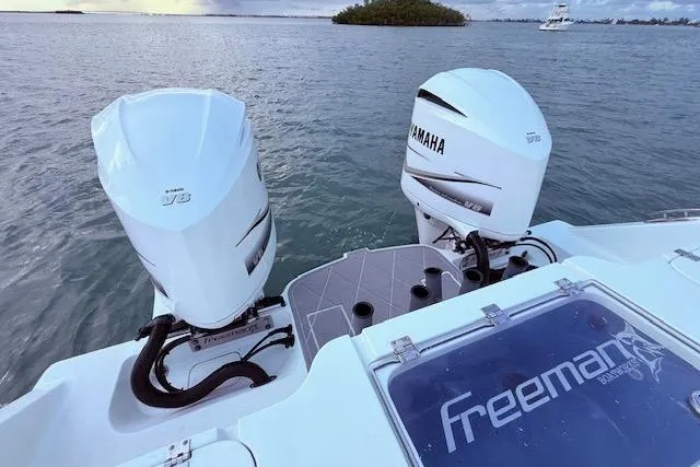 Slide: The Image of Freeman 34 boat with twin Yamaha outboard engines on a calm sea, 2019 model. - 45