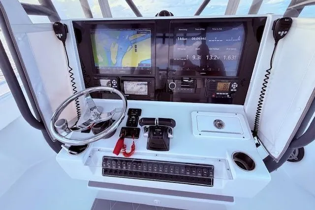 Slide: The Image of Cockpit of 2019 Freeman 34 boat with navigation screens and controls. - 50
