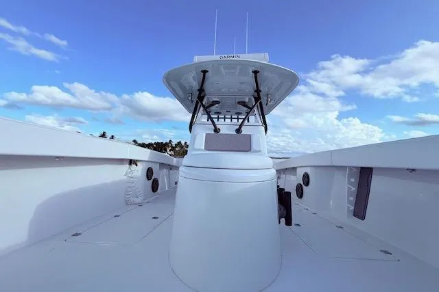 Slide: The Image of 2019 Freeman 34 boat with Garmin equipment, clear sky, and ocean view. - 62