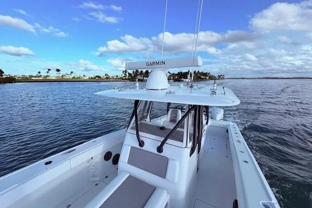 Slide: The Image of 2019 Freeman 34 boat on calm water under a blue sky. - 65