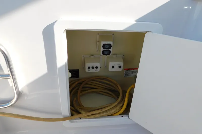 Slide: The Image of Electrical compartment of 1996 Chris-Craft 340 Crowne boat with coiled cable. - 19