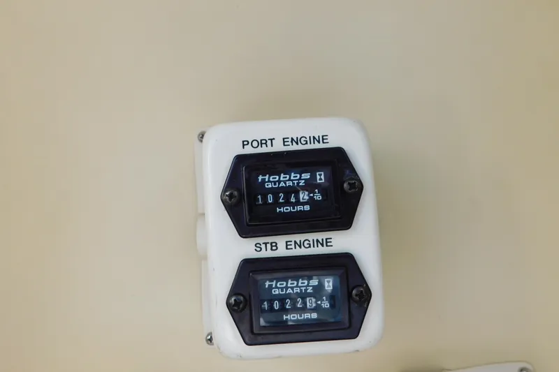Slide: The Image of Hour meters for port and starboard engines on 1996 Chris-Craft 340 Crowne boat. - 20