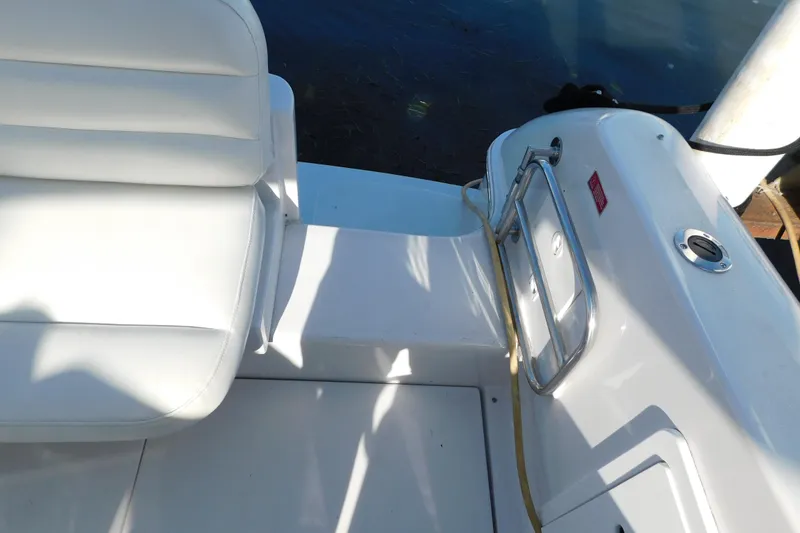 Slide: The Image of 1996 Chris-Craft 340 Crowne boat interior with white seating and railing. - 23