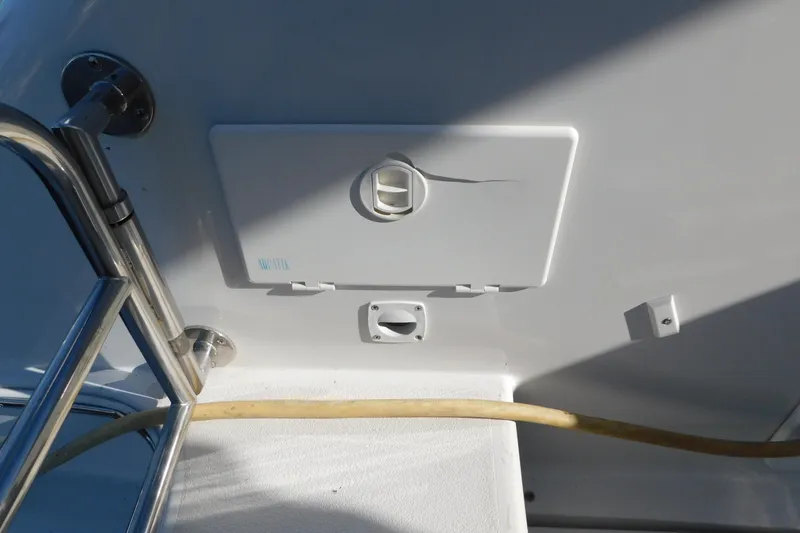 Slide: The Image of 1996 Chris-Craft 340 Crowne boat deck with utility panel and railing. - 24