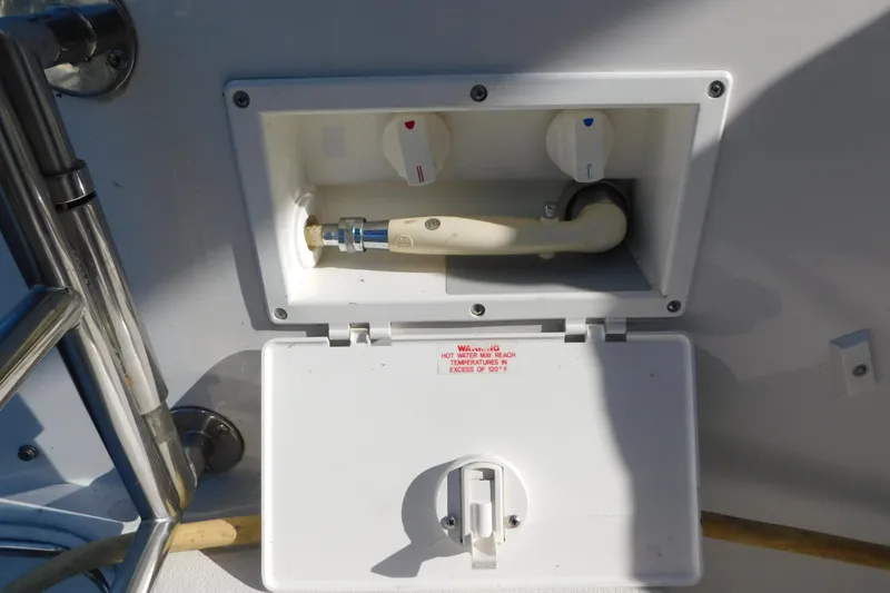 Slide: The Image of 1996 Chris-Craft 340 Crowne boat shower controls with hot and cold water knobs. - 25