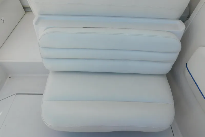 Slide: The Image of White cushioned seating on 1996 Chris-Craft 340 Crowne boat interior. - 29