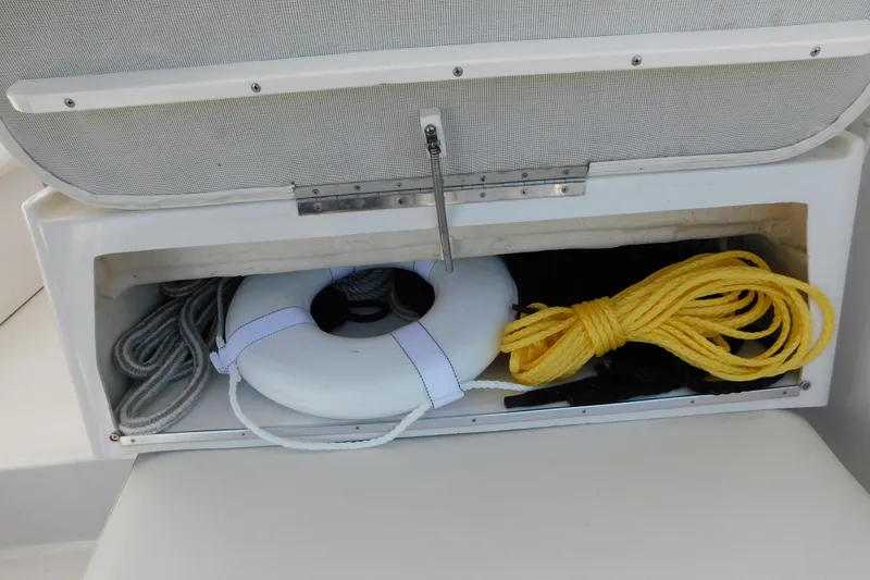 Slide: The Image of Storage compartment on 1996 Chris-Craft 340 Crowne with ropes and life ring. - 30