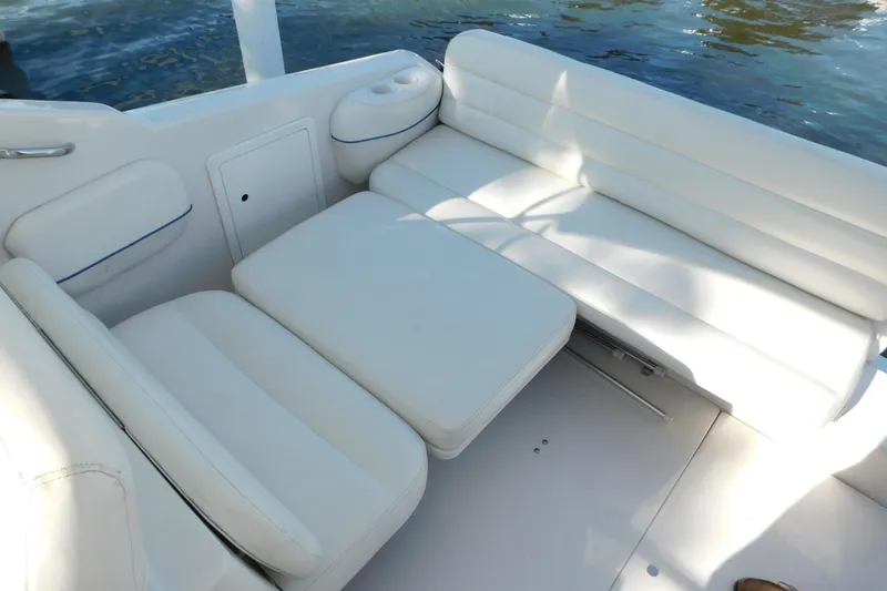 Slide: The Image of 1996 Chris-Craft 340 Crowne boat interior with white cushioned seating. - 32