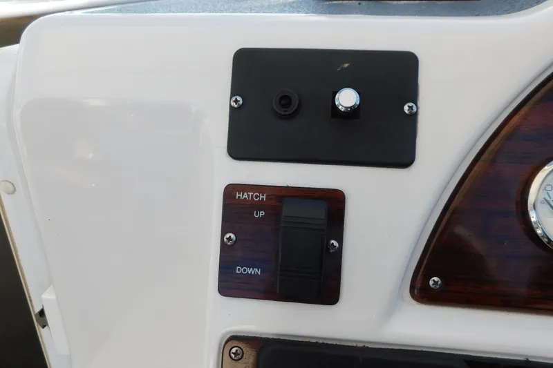 Slide: The Image of 1996 Chris-Craft 340 Crowne boat dashboard with hatch control switch. - 38