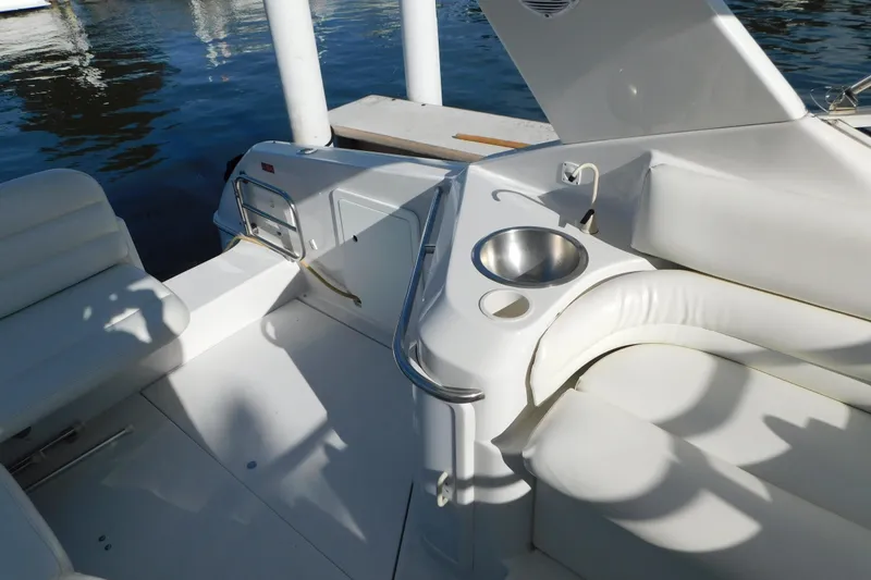 Slide: The Image of 1996 Chris-Craft 340 Crowne boat interior with white seating and built-in sink. - 45