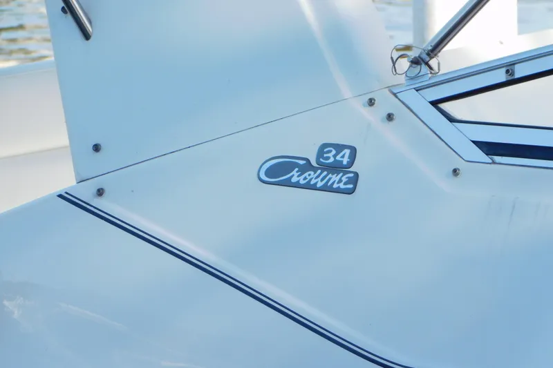 Slide: The Image of 1996 Chris-Craft 340 Crowne boat detail with model emblem and sleek design. - 5