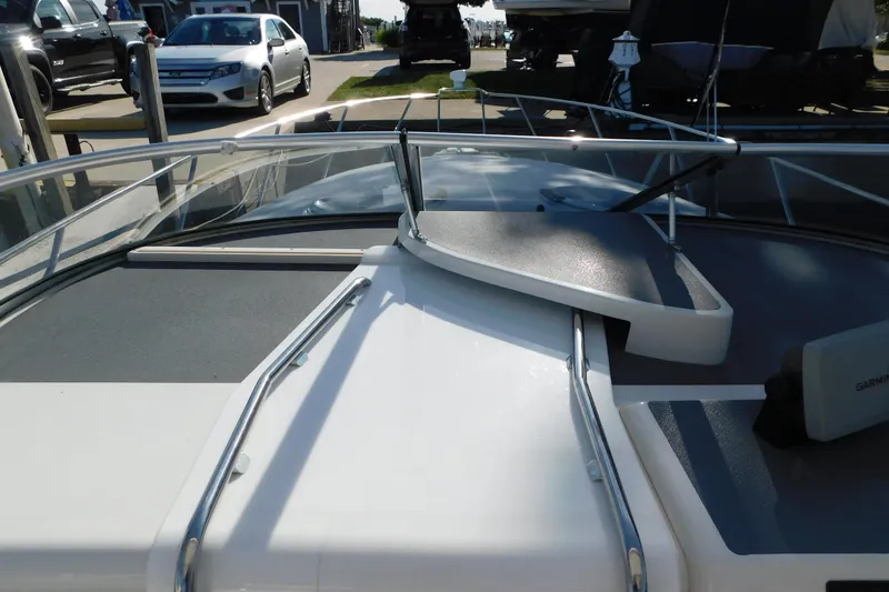 Slide: The Image of 1996 Chris-Craft 340 Crowne boat deck with railing and Garmin equipment. - 50