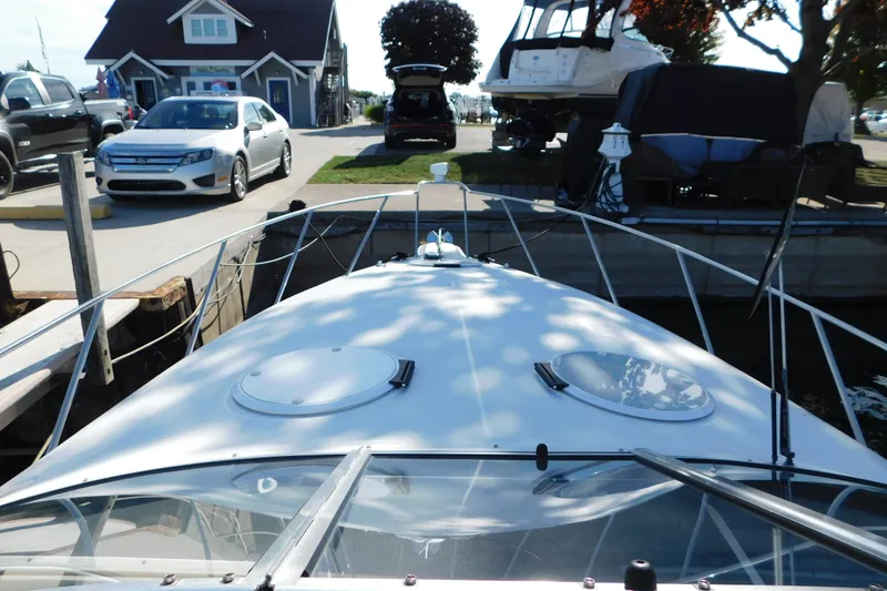 Slide: The Image of 1996 Chris-Craft 340 Crowne boat docked near cars and buildings. - 51