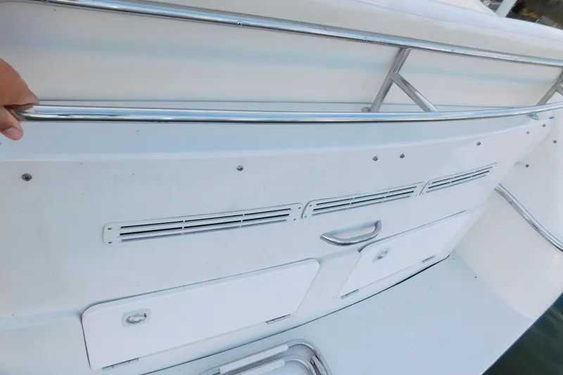 Slide: The Image of 1996 Chris-Craft 340 Crowne boat deck with stainless steel railing and storage compartments. - 52