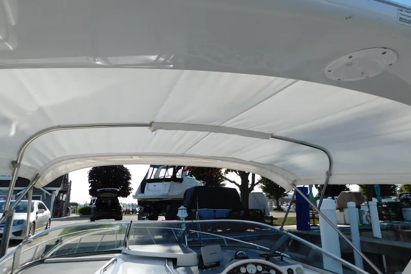 Slide: The Image of 1996 Chris-Craft 340 Crowne boat with canopy, docked at marina. - 54