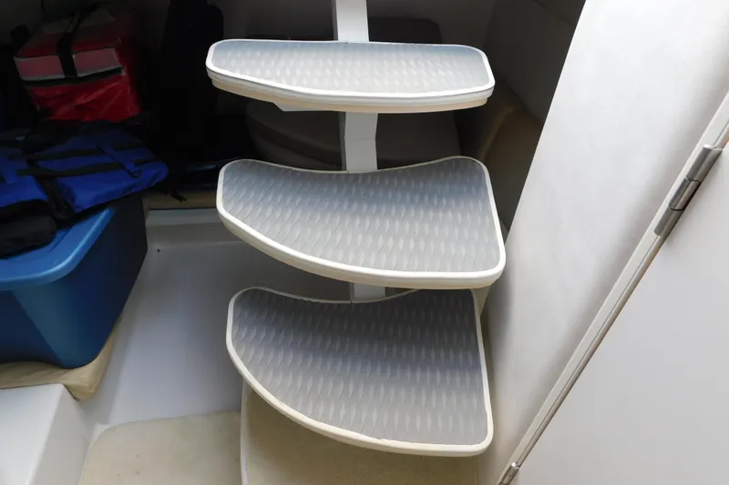 Slide: The Image of Interior steps of a 1996 Chris-Craft 340 Crowne boat, featuring non-slip surfaces. - 58