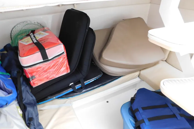 Slide: The Image of Interior storage area of a 1996 Chris-Craft 340 Crowne boat with cushions and gear. - 60