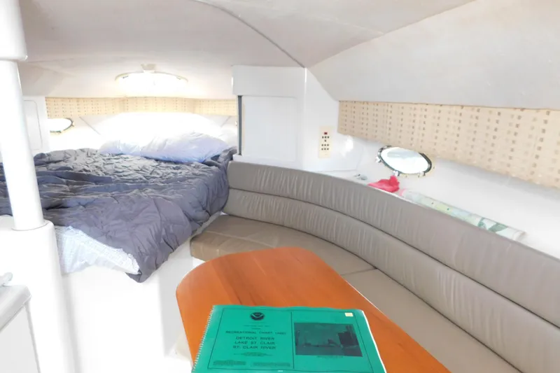Slide: The Image of 1996 Chris-Craft 340 Crowne cabin interior with bed, seating, and table. - 68