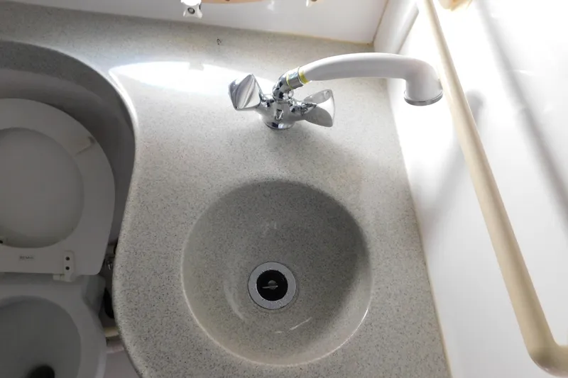 Slide: The Image of Bathroom sink and faucet in 1996 Chris-Craft 340 Crowne boat. - 88