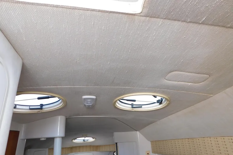 Slide: The Image of Interior ceiling of 1996 Chris-Craft 340 Crowne boat with circular windows. - 90