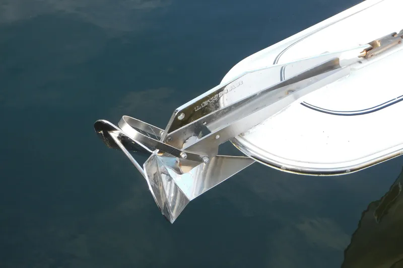 Slide: The Image of Chrome anchor on 1996 Chris-Craft 340 Crowne boat, reflecting on water. - 91
