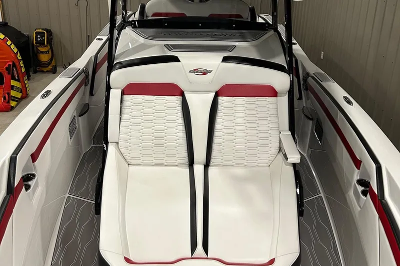 Slide: The Image of 2023 Sunsation 32 CCX boat interior with white and red seating, modern design. - 10
