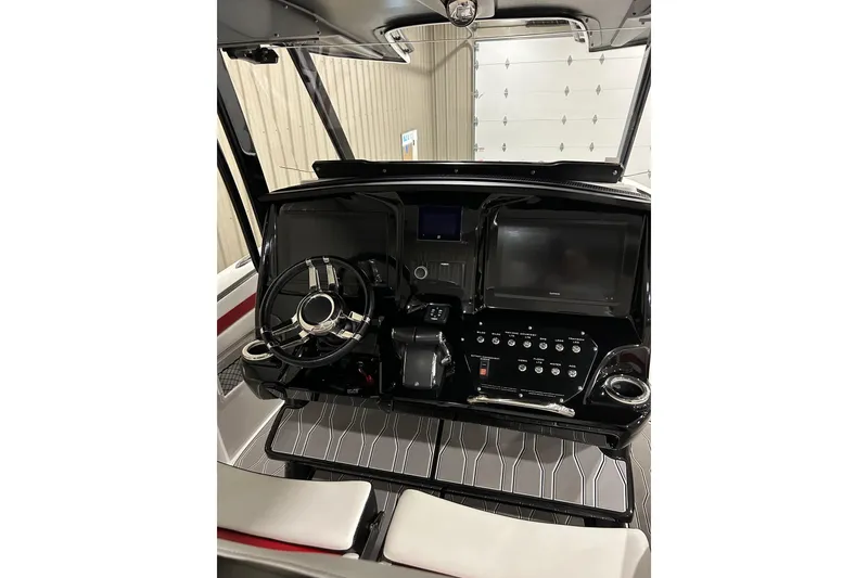 Slide: The Image of 2023 Sunsation 32 CCX boat dashboard with modern controls and sleek design. - 5