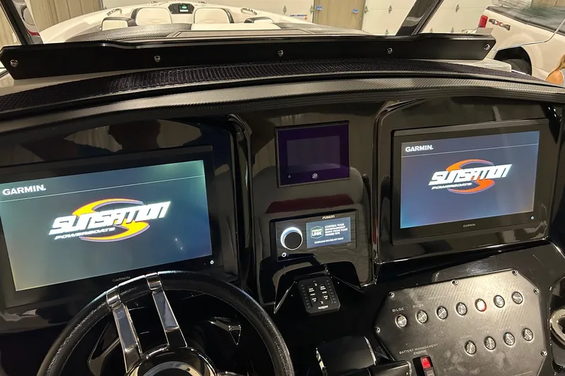 Slide: The Image of Dashboard of 2023 Sunsation 32 CCX boat with Garmin displays and controls. - 6