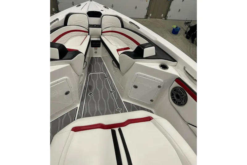 Slide: The Image of 2023 Sunsation 32 CCX boat interior with red and black accents, modern seating, and sleek design. - 8